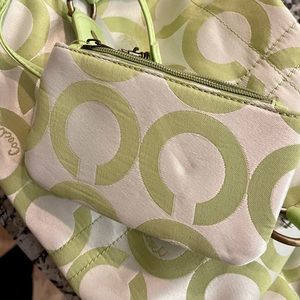 Soft green coach purse and wristlet.